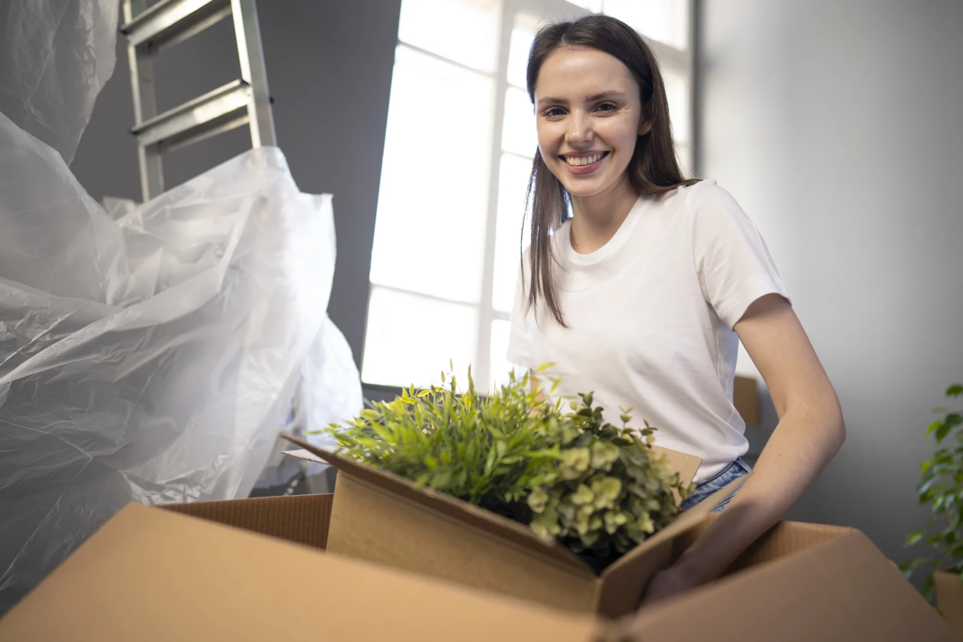 woman prepare plants to the moving